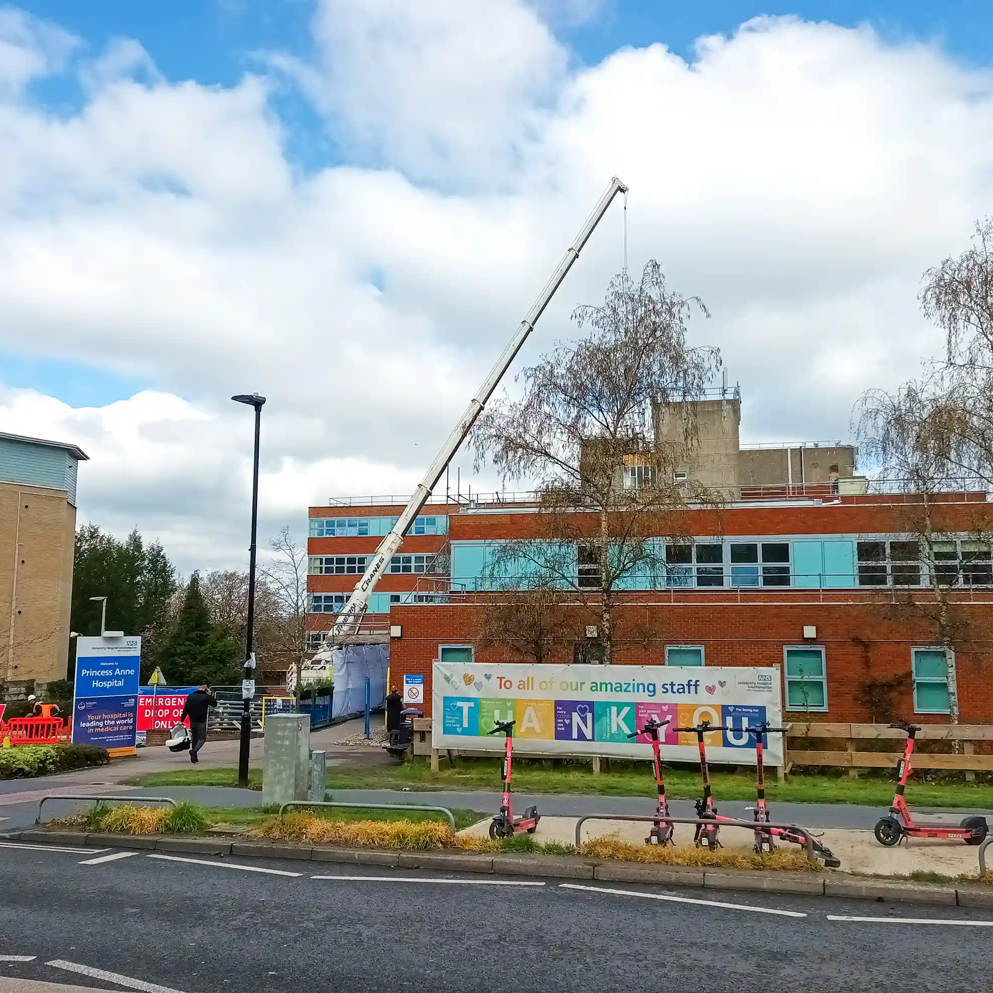 Crane lifting steel onto roof